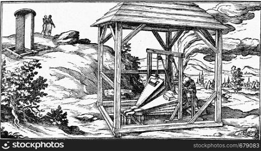 Ventilation well of an old mine, vintage engraved illustration. From the Universe and Humanity, 1910.
