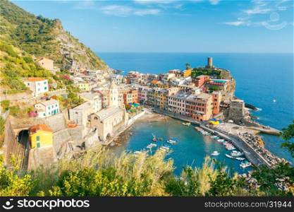Vernazza. Ancient Italian village on the Mediterranean coast.. The view from the high hill village of Vernazza and the old harbor at sunset. Cinque Terre National Park. Liguria. Italy.