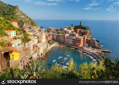 Vernazza. Ancient Italian village on the Mediterranean coast.. The view from the high hill village of Vernazza and the old harbor at sunset. Cinque Terre National Park. Liguria. Italy.