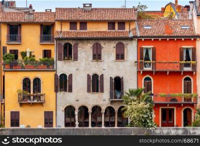 Verona. Facades of old houses.. Multicolored traditional facades of old houses in Verona. Italy.