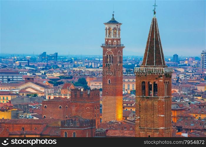 Verona skyline with Santa Anastasia Church and Torre dei Lamberti or Lamberti Tower at night, view from Piazzale Castel San Pietro, Italy
