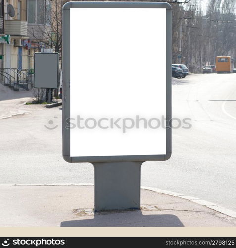 Vertical blank billboard on the city street