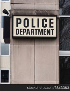 Vertical composition of Police Department sign outside