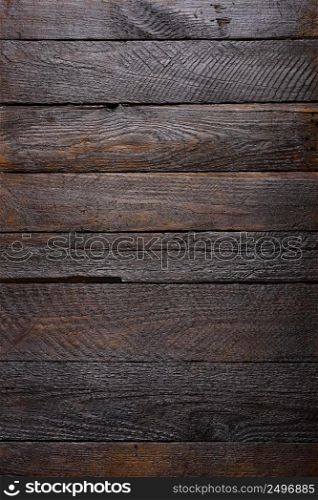 Vertical dark wooden planks background top view