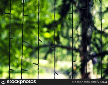 Vertical garland with green bokeh background backdrop