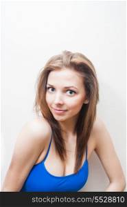 vertical head and shoulders shot of the blond haired lady in blue tank top