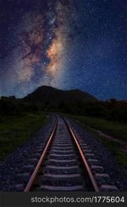 Vertical Milky way galaxy stars and space dust in the universe with railway foreground, long speed exposure.. Vertical Milky way