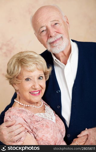 Vertical orientation portrait of a beautiful senior couple in their eighties.