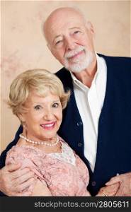 Vertical orientation portrait of a beautiful senior couple in their eighties.