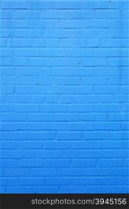 vertical part of bright sky blue painted brick wall