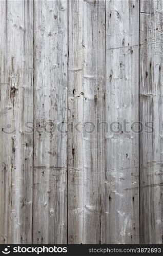 vertical part of fence with grey weathered planks