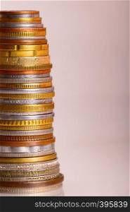 Vertical photo of coins stacked