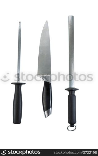 Vertical photo of single large kitchen knife and two sharpeners isolated on white