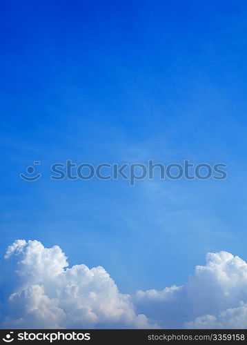 Vertical photo of white clouds in the blue sky