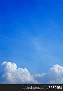 Vertical photo of white clouds in the blue sky