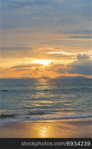 vertical photograph golden beautiful sunset and seascape in Krabi province, Thailand