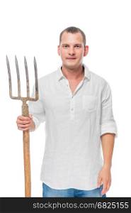 Vertical portrait of a farmer with forks in his hand on a white background