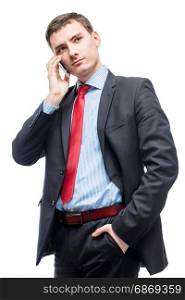 Vertical portrait of a man with a telephone, an entrepreneur is isolated