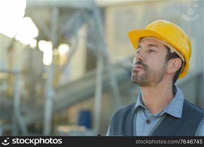 vertical portrait of engineer smoking cigarette