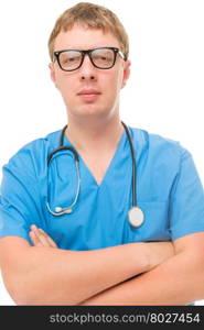Vertical portrait of the doctor in a blue working clothes and glasses on a white background