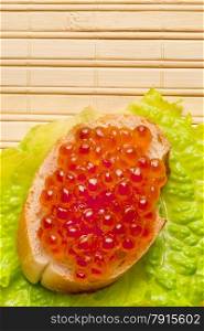 Vertical shot sandwich with red caviar