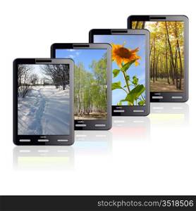 Vertical Tablet computer isolated on the white background. Four different colors stand one by one. Times of the year.