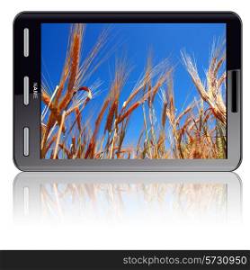 Vertical Tablet computer isolated on the white background. Screen saver and ears of wheat.