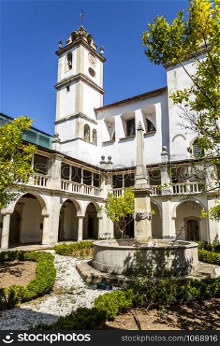 Vertical view of the Renaissance cloister with roman arches and Doric columns of the Monastery of Saint Mary of Lorvao, Coimbra, Portugal
