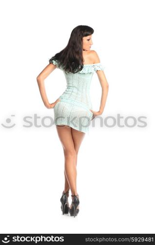 Very beautiful and attractive young black haired woman in elegant sexy dress and with old fashion hair style from back
