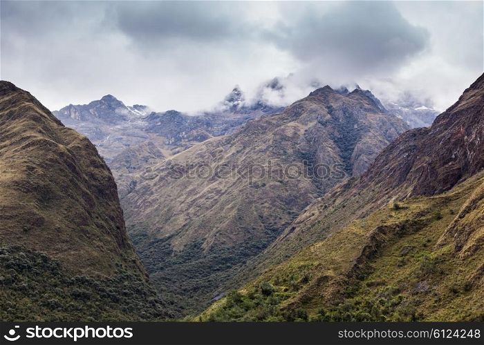 Very beautiful mountains in the dense clouds