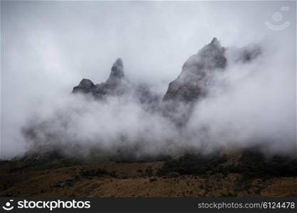 Very beautiful mountains in the dense clouds