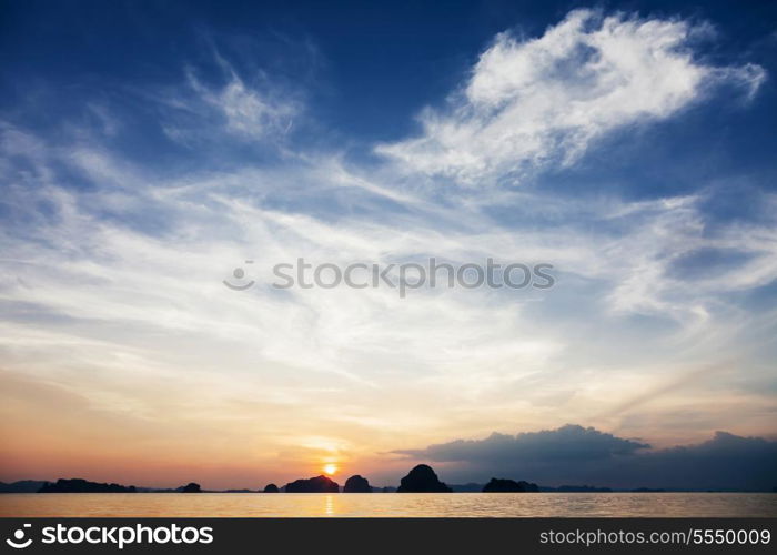 Very beautiful sea sunset with islands on background