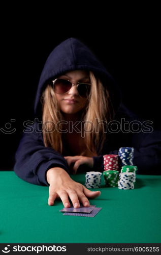 Very beautiful woman playing texas hold&rsquo;em poker