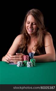 Very beautiful woman playing texas hold&rsquo;em poker