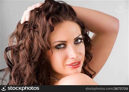 very cute brunette with long eyelashes and hair stylish looking in camera