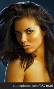 very cute girl with long dark hair,golden make up and shining gold color lips