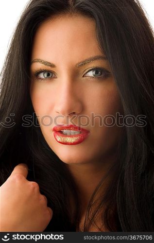 very cute young woman with a golden creative make up looking sexy in camera