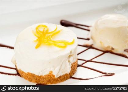 very elegant lemon mousse dessert served whith lemon peel on top and vanilla ice cream on side, MORE DELICIOUS FOOD ON PORTFOLIO