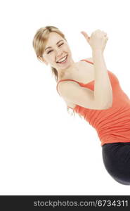 very happy fitness woman showing thumb up. blonde very happy fitness woman showing thumb up on white background