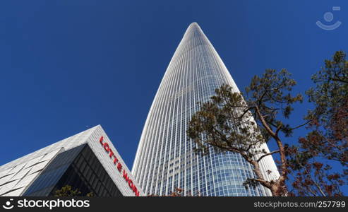 Very high skyscraper. Bottom view. Lotte World Tower, Seoul city, South Korea. January 2018