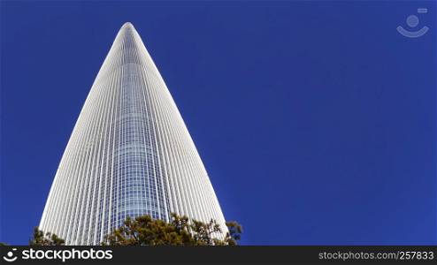 Very high skyscraper. Bottom view. Lotte World Tower, Seoul city, South Korea. January 2018