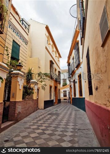 very narrow traditional spanish street. Sevilla, Andalusia. Spain