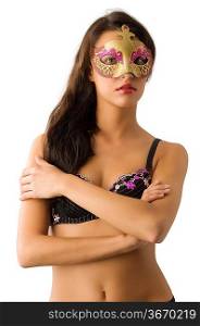 very nice girl with long hair in bra and carnival mask looking in camera