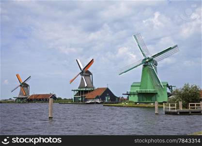 Very old authentic windmills in a row in Zaandam or Zaanse Schans, Neterhlands, Holland, Europe.&#xA;Very popular with the tourists and old are of Netherlands