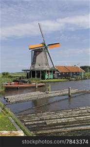 Very old authentic windmills in a row in Zaandam or Zaanse Schans, Neterhlands, Holland, Europe.&#xA;Very popular with the tourists and old are of Netherlands
