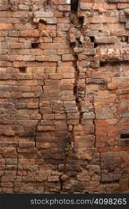 Very old background image of a brick wall that is falling apart.