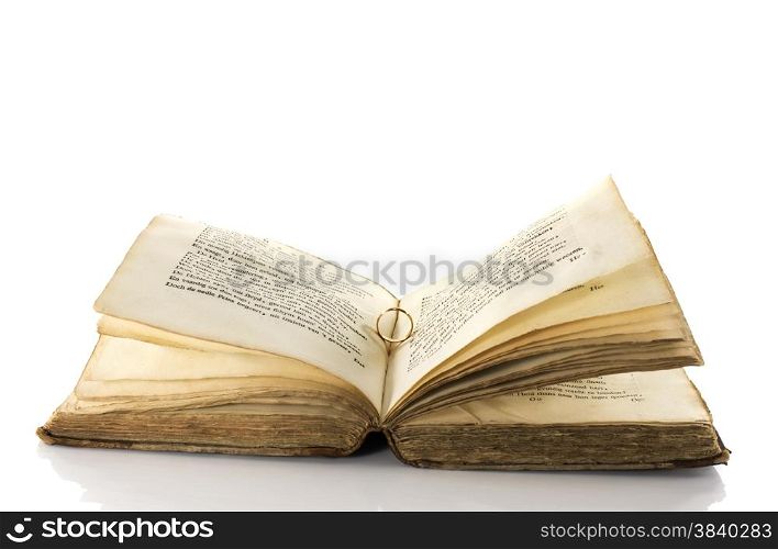 very old book with ring of romantic love for wedding or valentine david isolated on white