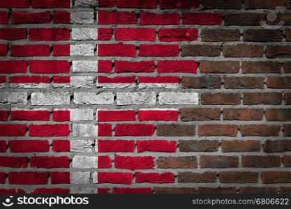 Very old dark red brick wall texture with flag - Denmark