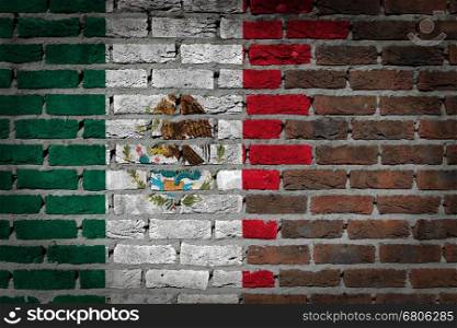 Very old dark red brick wall texture with flag - Mexico