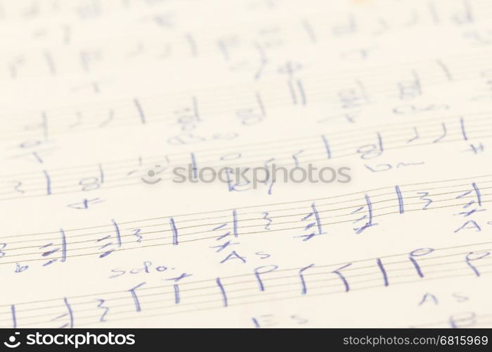 Very old handwritten sheet music, paper background